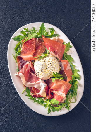 Antipasto with prosciutto and mozzarella Antipasto with prosciutto and mozzarella 77404030