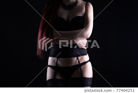 Photo of the young woman in silk lingerie with long hair Photo of the young woman in silk lingerie with long hair 77404251