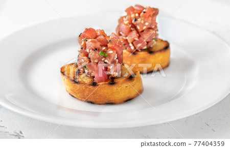 Sandwiches with tuna tartare Sandwiches with tuna tartare 77404359