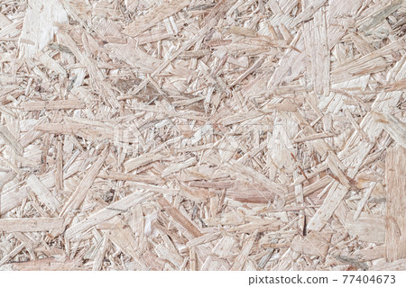 Chipboard, OSB -Oriented strand board particle pressed recycled wood panel background with grainy wooden fiber pattern backdrop in natural beige brown color 77404673