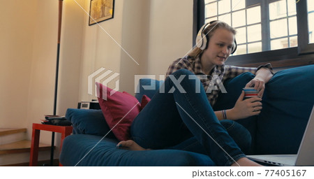 Video chatting with friend who is miles away 77405167