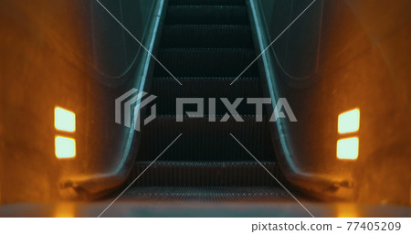 Illuminated escalator moving up Illuminated escalator moving up 77405209