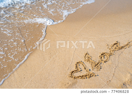 Heart and LOVE drawn on the beach of a beautiful sea, refreshing and neutral color in the daytime Background material Heart and LOVE drawn on the beach of a beautiful sea, refreshing and neutral color in the daytime Background material 77406828
