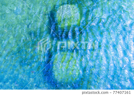 Emerald green shallow riffle sea level Emerald green shallow riffle sea level 77407161