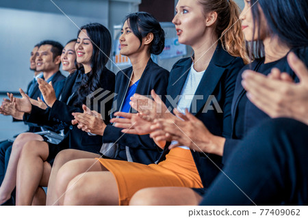 Businessmen and businesswomen celebrating success. 77409062