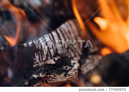 Firewood in flame close-up stock photography. Firewood in flame close-up stock photography. 77409970