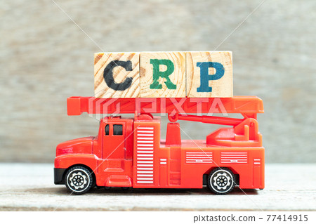 Fire ladder truck hold letter block in word CRP (abbreviation of C-Reactive Protein Test) on wood background Fire ladder truck hold letter block in word CRP (abbreviation of C-Reactive Protein Test) on wood background 77414915