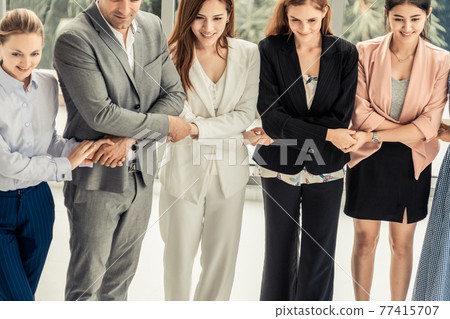 Business people holding hands together teamwork. Business people holding hands together teamwork. 77415707