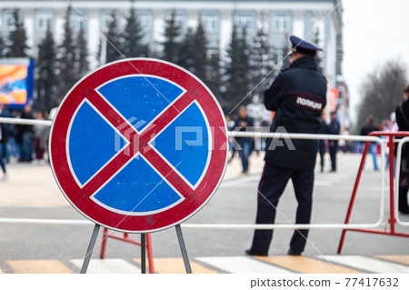 Russia Kemerovo 2019-05-10 sign means driving and parking is prohibited stands on pedestrian Russia Kemerovo 2019-05-10 sign means driving and parking is prohibited stands on pedestrian 77417632