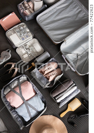 Organization of storage carrying necessary things in comfortable case with konmari method on bed 77422623