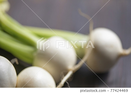 A bunch of turnips on a board A bunch of turnips on a board 77424469