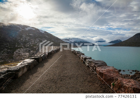 Styggevatnet glacial lake dam with Austdalsbreen glacier in background Jostedalsbreen National Park Sogn og Fjordane Norway Scandinavia 77426131
