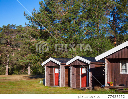 Wooden camping cabins at a campsite in Norway Scandinavia 77427252