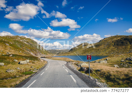 Cycle route sign on scenic mountain road in Southern Norway Cycle route sign on scenic mountain road in Southern Norway 77427277