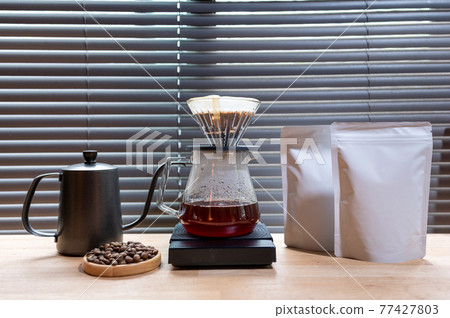 Hand drip coffee, Barista making drip coffee with mockup blank package coffee Alternative ways of brewing Coffee shop concept 77427803