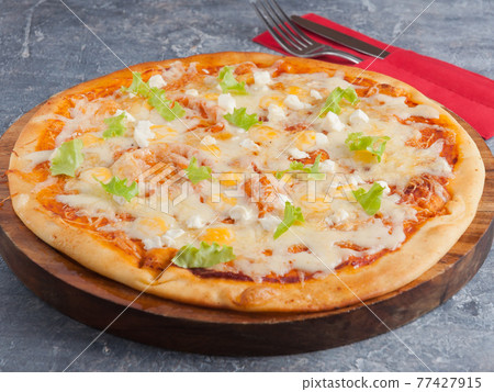 four cheese pizza or Quattro formaggio on a wooden Board 77427915