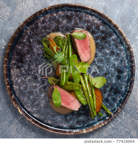 tasty hot dish: beef, asparagus, potatoes, avocado. Top view 77428064