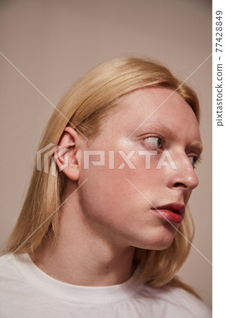 Fashion albino model man portrait isolated on white background 77428849