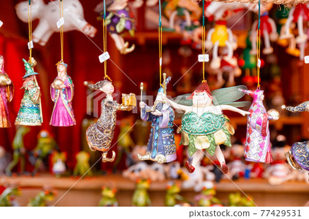 Fairytale character Christmas baubles for sale at Christmas market stall in Berlin Germany Fairytale character Christmas baubles for sale at Christmas market stall in Berlin Germany 77429531
