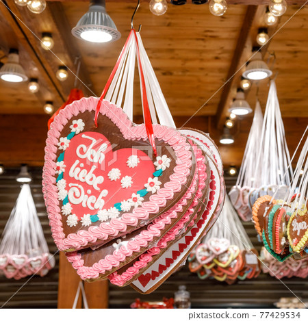 Traditional gingerbread hearts at Christmas market stall in Berlin Germany 77429534