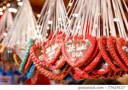 Traditional gingerbread hearts at Christmas market stall in Berlin Germany 77429537