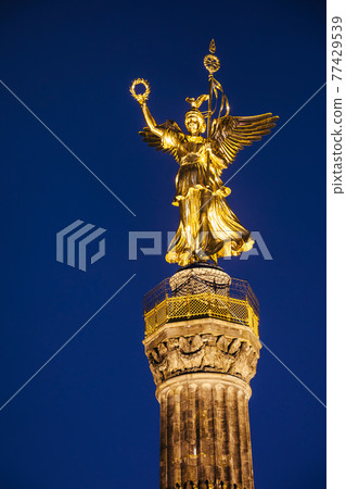 The statue of Victoria at Berlin Victory Column (Siegessaule) monument at night Tiergarten Berlin Germany 77429539