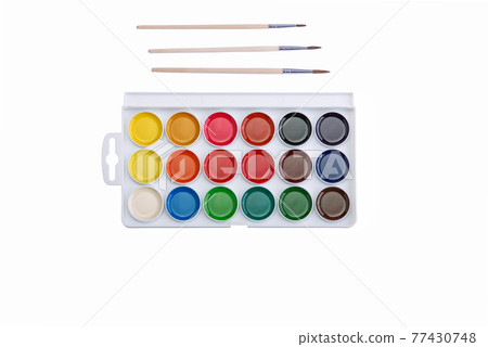 Multicolored aquarelle paints in paint box with brushes on white background. Multicolored aquarelle paints in paint box with brushes on white background. 77430748