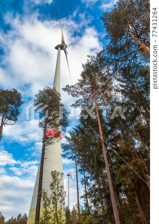 Wind turbines in forest Germany Green energy concept 77431264