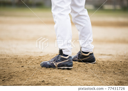 Men playing grass baseball Men playing grass baseball 77431726