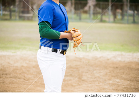 Men playing grass baseball Men playing grass baseball 77431736
