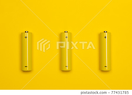 Yellow AAA alkaline batteries colorful background Yellow AAA alkaline batteries colorful background 77431785