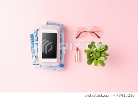 Empty phone with women outfit. Online shopping 77433286