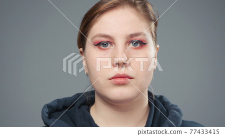 Photo of the young stout woman, portrait 77433415