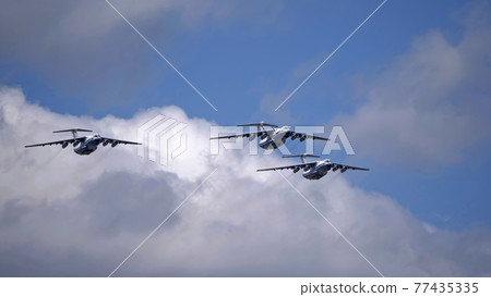 MOSCOW, RUSSIA - MAY 7, 2021: Avia parade in Moscow. 3 Ilyushin Il-76 multi-purpose four-engined strategic airlifters fly in the sky on parade of Victory in World War II in Moscow, Russia MOSCOW, RUSSIA - MAY 7, 2021: Avia parade in Moscow. 3 Ilyushin Il-76 multi-purpose four-engined strategic airlifters fly in the sky on parade of Victory in World War II in Moscow, Russia 77435335