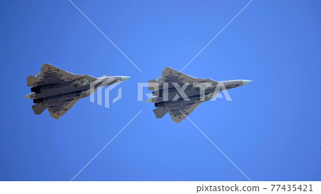 MOSCOW, RUSSIA - MAY 7, 2021: Avia parade in Moscow. Sukhoi Su-57 in the sky on parade of Victory in World War II in Moscow, Russia MOSCOW, RUSSIA - MAY 7, 2021: Avia parade in Moscow. Sukhoi Su-57 in the sky on parade of Victory in World War II in Moscow, Russia 77435421