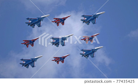 MOSCOW, RUSSIA - MAY 7, 2021: Avia parade in Moscow. group jet fighter aircraft MiG-35 and Su-30 in the sky on parade of Victory in World War II in Moscow, Russia MOSCOW, RUSSIA - MAY 7, 2021: Avia parade in Moscow. group jet fighter aircraft MiG-35 and Su-30 in the sky on parade of Victory in World War II in Moscow, Russia 77435425