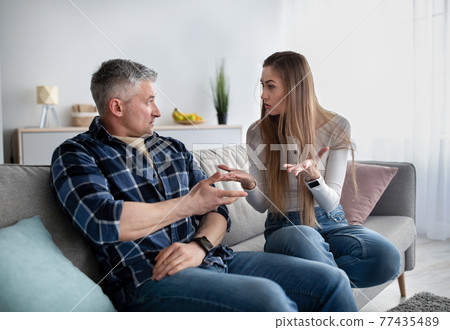 Frustrated mature couple quarreling at home, being angry, facing family problems 77435489