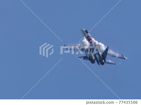 Moscow Russia Zhukovsky Airfield 31 August 2019: The Russian Knights Russkie Vityazi aerobatic team performs a demonstration flight with aerobatics figures of the international aerospace salon 77435506