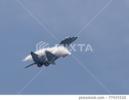 Moscow Russia Zhukovsky Airfield 31 August 2019: aerobatic MiG-29 perfoming demonstration flight of the international aerospace salon MAKS-2019 Moscow Russia Zhukovsky Airfield 31 August 2019: aerobatic MiG-29 perfoming demonstration flight of the international aerospace salon MAKS-2019 77435520