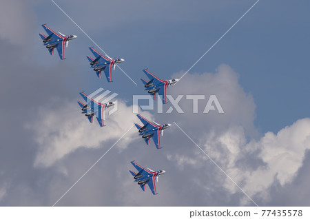 Moscow Russia Zhukovsky Airfield 31 August 2019: The Russian Knights Russkie Vityazi aerobatic team performs a demonstration flight with aerobatics figures of the international aerospace salon Moscow Russia Zhukovsky Airfield 31 August 2019: The Russian Knights Russkie Vityazi aerobatic team performs a demonstration flight with aerobatics figures of the international aerospace salon 77435578