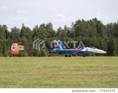 Moscow Russia Zhukovsky Airfield 31 August 2019: The Russian Knights Russkie Vityazi aerobatic team performs a demonstration flight with aerobatics figures of the international aerospace salon Moscow Russia Zhukovsky Airfield 31 August 2019: The Russian Knights Russkie Vityazi aerobatic team performs a demonstration flight with aerobatics figures of the international aerospace salon 77435579