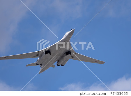 MOSCOW, RUSSIA - MAY 7, 2021: Avia parade in Moscow. strategic bomber and missile platform Tu-160 in the sky on parade of Victory in World War II in Moscow, Russia 77435665