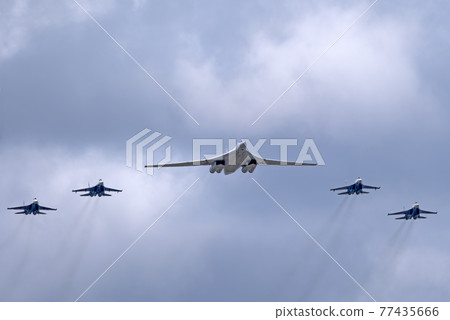 MOSCOW, RUSSIA - MAY 7, 2021: Avia parade in Moscow. su-35 and strategic bomber and missile platform Tu-160 in the sky on parade of Victory in World War II in Moscow, Russia MOSCOW, RUSSIA - MAY 7, 2021: Avia parade in Moscow. su-35 and strategic bomber and missile platform Tu-160 in the sky on parade of Victory in World War II in Moscow, Russia 77435666