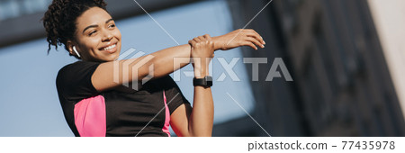 Stretching, warming up and exercising before jogging in city in morning Stretching, warming up and exercising before jogging in city in morning 77435978