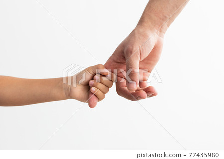 Closeup of father and daughter holding hands 77435980