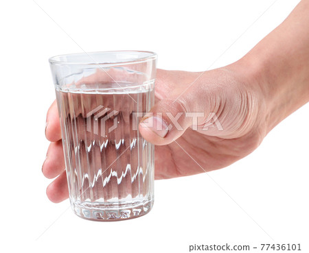 Glass of water in hand on a white background. Isolated 77436101