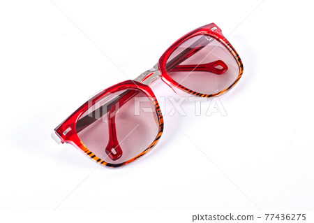 Red sunglasses isolated on white background. 77436275