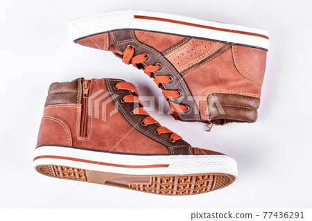 New brown sneakers, white background. 77436291