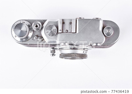 Silver photo camera, top view. Silver photo camera, top view. 77436419