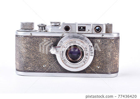 Old grey camera on white background. Old grey camera on white background. 77436420